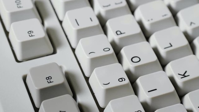 Finger presses F8 button on keyboard