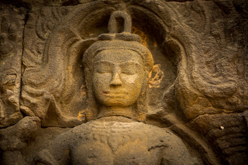 Fototapeta na wymiar praying buddah in aisa, close up of a sculpture with the hand and smiling face 