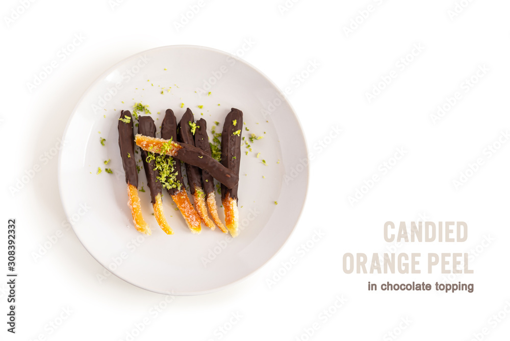 Wall mural Candied orange peel in chocolate or sugar is a favorite Christmas treat for children and adults. Image of homemade candied orange peel some pieces dipped in chocolate. Top view