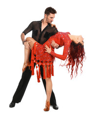 Passionate young couple dancing on white background