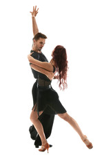 Passionate young couple dancing on white background