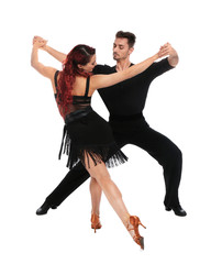 Passionate young couple dancing on white background