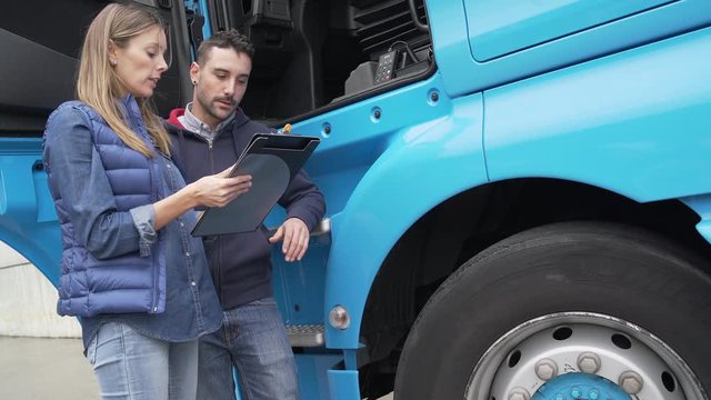 Logistics manager controlling truck driver schedule