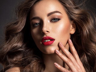  Beautiful face of an attractive model with red lipstick.