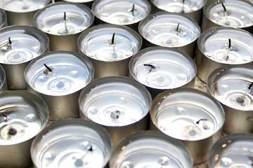 Several burnt small tea candles with clear paraffin