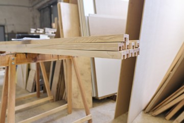 Fototapeta na wymiar Wooden furniture details, background carpentry woodworking woodshop