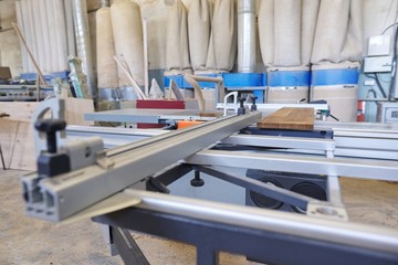 Background carpentry woodworking woodshop, machines and tools, wooden boards