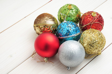 Christmas white wooden pattern with Christmas tree branches and toys