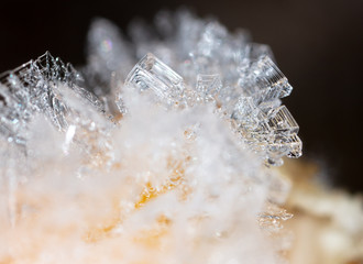 White snowflakes on an orange orange as a background
