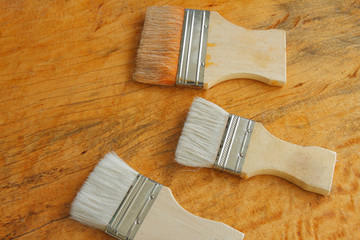 paint brush on wooden table background