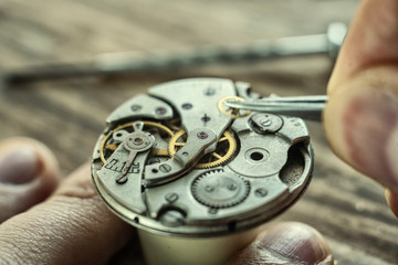 Watchmaker is repairing the wristwatch, mechanical watch