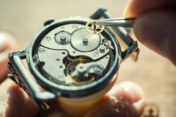 Watchmaker is repairing the wristwatch, mechanical watch