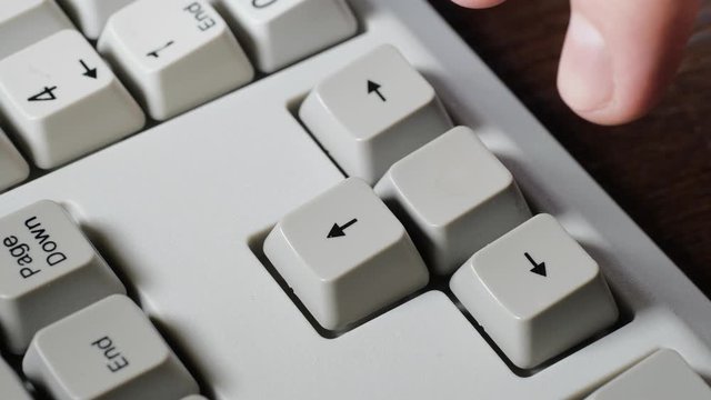 Finger presses RIGHT button on keyboard