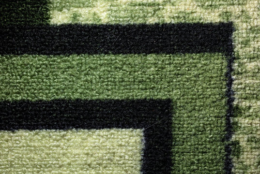 Fabric on a green carpet as an abstract background