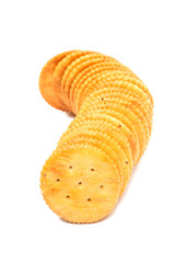 A stack of round crackers isolated on white background.