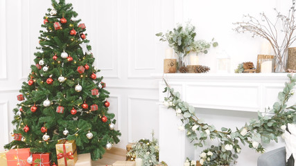 Christmas tree decorated holiday winter xmas celebration present gift to family decorate with ornament golden ball in cozy living room. Merry Christmas and happy new year festival traditional concept.