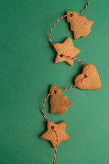 green background with ginger biscuits on the red ribbon