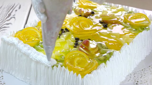 Cake decoration with white whipped cream. Big beautiful cake with fruits and jelly. Best ideas about fresh fruit cake.