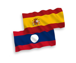 National vector fabric wave flags of Laos and Spain isolated on white background. 1 to 2 proportion.