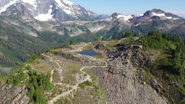 Drone footage of the Cascade Range peaks, Mt Baker area near the North Cascades National park in the Pacific Northwest, a wilderness near Seattle, Washington