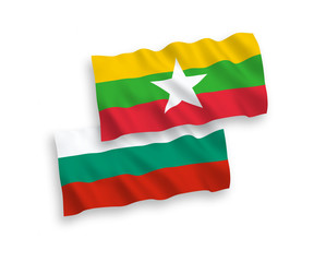 Fototapeta premium National vector fabric wave flags of Bulgaria and Myanmar isolated on white background. 1 to 2 proportion.