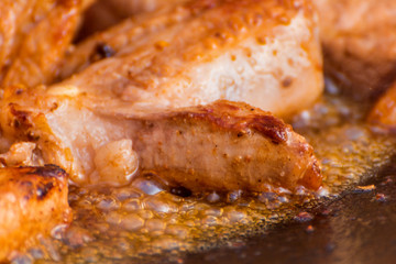 The meat is cooked in a cauldron