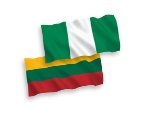 National vector fabric wave flags of Lithuania and Nigeria isolated on white background. 1 to 2 proportion.