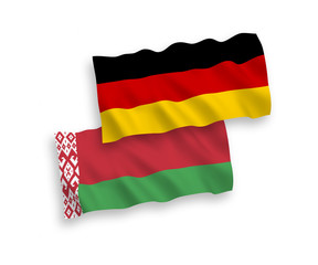 National vector fabric wave flags of Germany and Belarus isolated on white background. 1 to 2 proportion.
