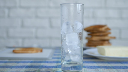 Image with Ice Cubes in a Empty Glass for Water from the Table