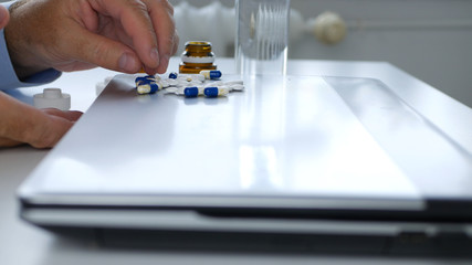 Image with a Suffering Man in Office Room Taking Medical Pills