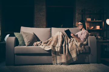Profile photo of homey lady read exciting historic novel interested book worm sitting couch covered...