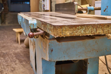 Vintage jointer in a workshop. Old used but working planer