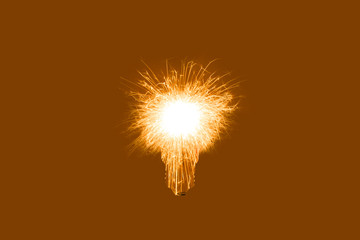 Bengal fire in lamp bulb isolated on brown background. New idea concept.
