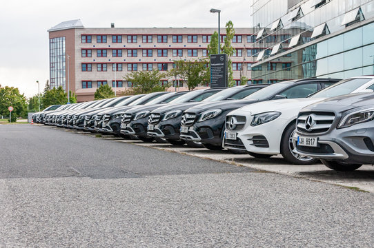 Mercedes Benz cars parked in row