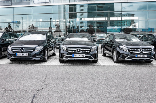 Mercedes Benz cars parked in row