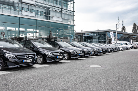 Mercedes Benz cars parked in row
