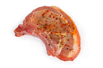 Pickled uncooked pork loin chop bone-in on white background