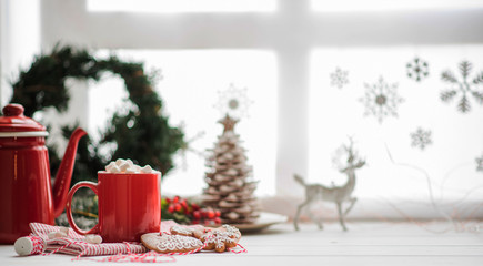 Christmas or New Year composition with cocoa, marshmallows, gingerbread cookies and christmas decorations. Copy space for your text.