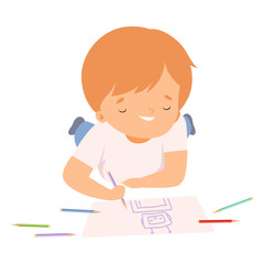 Smiling Boy Lying on his Stomach and Drawing Picture with Colorful Pencils, Cute Young Artist Cartoon Character, Kids Creative Hobby Vector Illustration