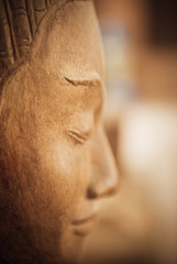 Fototapeta premium closeup of wooden buddhas, woodwork and craftsmanship 