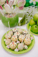 green apples and sweets on the table