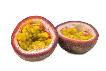 Whole passion fruit and a half maracuya fruit (Passiflora edulis) isolated on white background