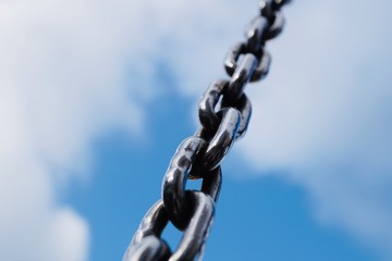 Naklejka premium strong steel chain for industry, blue background