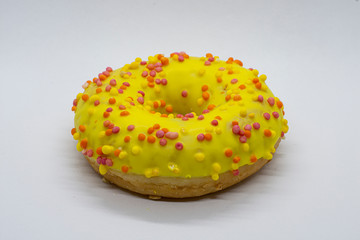 doughnut in banana glaze on a white background