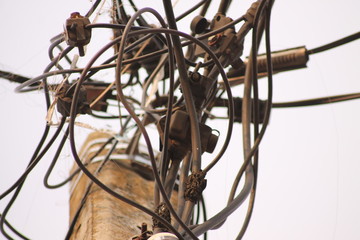 Fototapeta na wymiar the wires are twisted on electric poles