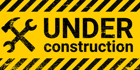 under construction site banner sign vector black and yellow diagonal stripes under construction, hammer and wrench repair sign with grunge texture