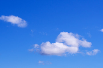 White clouds on a blue sky background