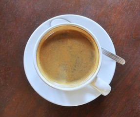 cup of coffee on wooden table
