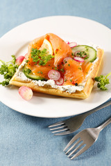 waffle with cream, smoked salmon and vegetable