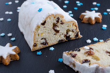traditional german christmas cake stollen with cookies and decoration